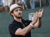 Justin Timberlake claps for the winner Marc Turnesa during the final round of the Justin Timberlake Shriners Hospitals for Children Open golf tournament at TPC Summerlin in Las Vegas on Sunday, Oct. 19, 2008.