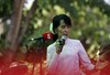 Myanmar pro-democracy icon Aung San Suu Kyi speaks to journalists during the press conference in her residence in Yangon, Myanmar Friday, March 30, 2012.