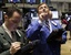 Traders work on the floor of the New York Stock Exchange, Wednesday, April 7, 2010