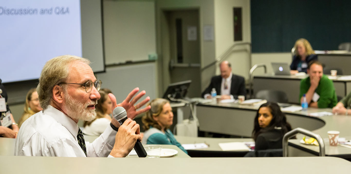 Faculty member talking with a microphone