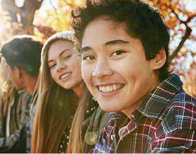 a teenage boy with his friends