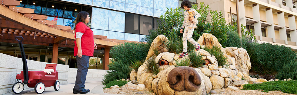 Packard children's patient and her mom in the garden