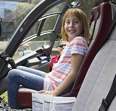 female patient and nurse sit on helecopter