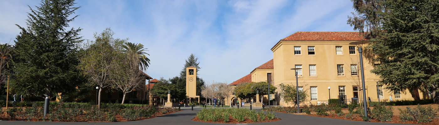 Photo of Cubberley Education Building and a street sign of Escondido and Lasuen Mall intersection