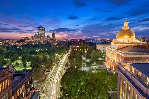 Twilight photo of a government capitol building and skyline