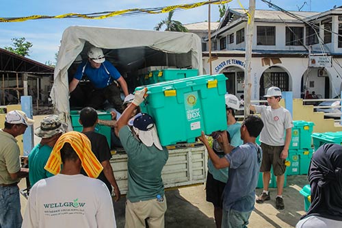 Men unloading a truck with emergency supplies