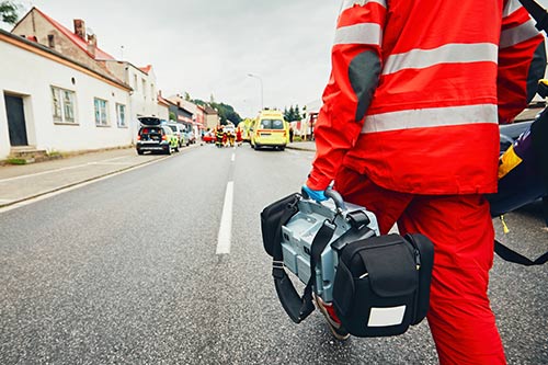 First responder walking down a street