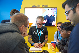 Google engineer demoing a product to conference attendees.